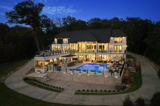 Exquisite Lake Minnetonka home with 160 feet of prime lakeshore on a picturesque 1.6 acre flat lot with two covered dock slips! Enjoy this private resort style retreat only minutes from downtown Wayzata.