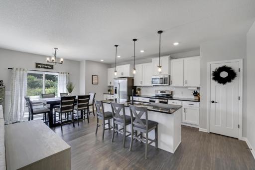 Welcome Home!! Look at this dream kitchen with crisp white cabinets and sterling silver appliances. Hurry Hurry and come see this beautiful home!!