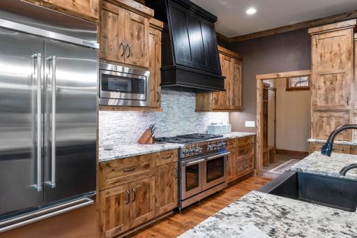 A dream kitchen with knotty alder cabinets, granite and butcher block countertops