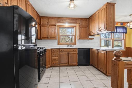 You will love the custom oak cabinets & crown molding along with newer appliances!