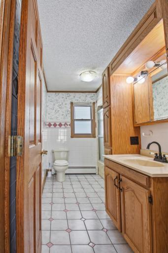 Spacious Main Floor Full bath with ceramic tile flooring