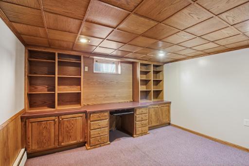 Nice 12 x 12 office with built in desk/shelving. The oak ceiling offers a comforting, warm atmosphere.