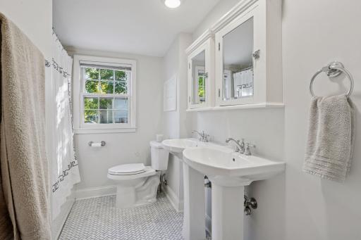 Full upper level bathroom with double sinks