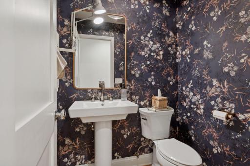Main level powder room with custom wallpaper