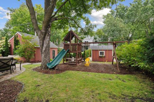 Great flat yard with room for playset, fire pit, and seating!