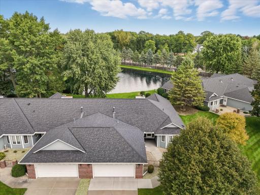 Aerial view of 1121 on right and pond behind it