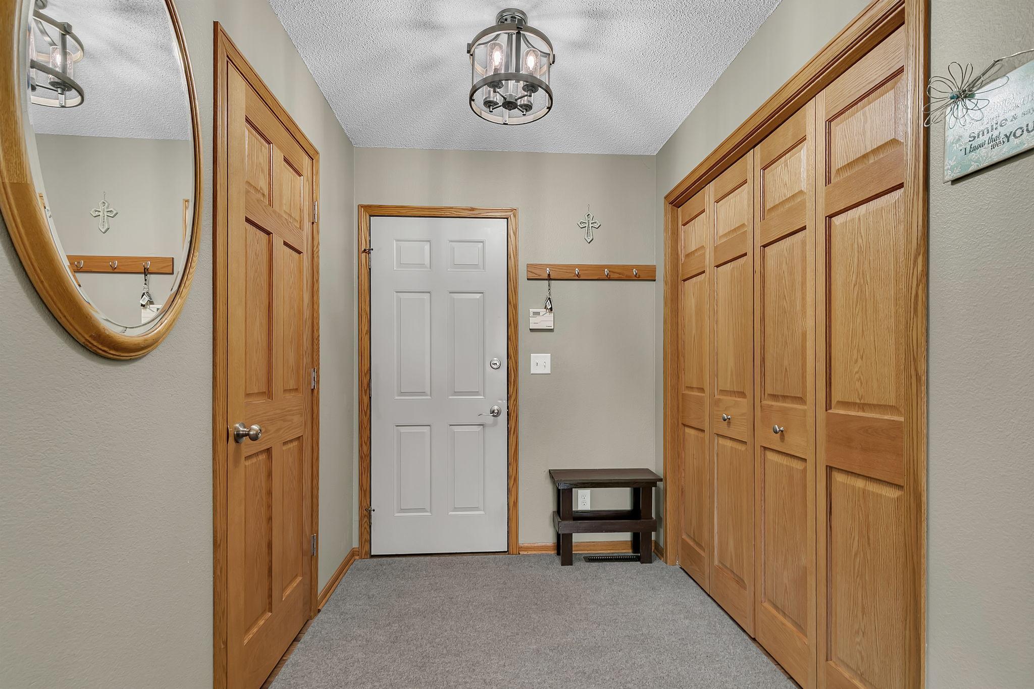 Upstairs 1/2 Bathroom (on the left) & Upper Garage Entry Forward