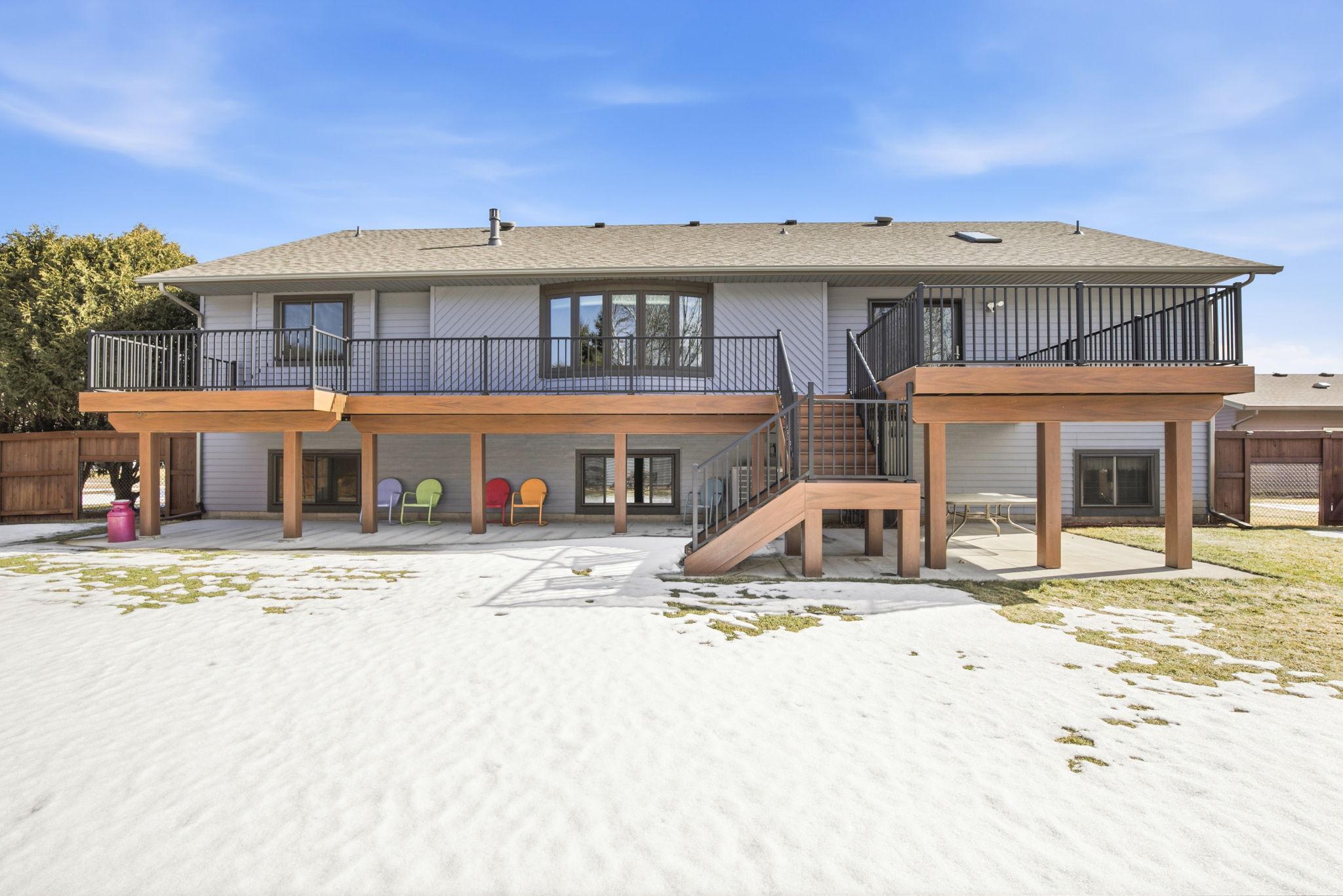 Exterior Rear of House w/maintenance Free Deck & Concrete Patio Below