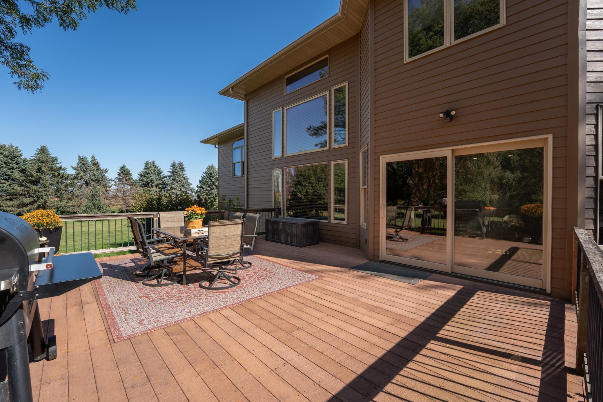 Outdoor entertaining spaces just steps from kitchen and family room.