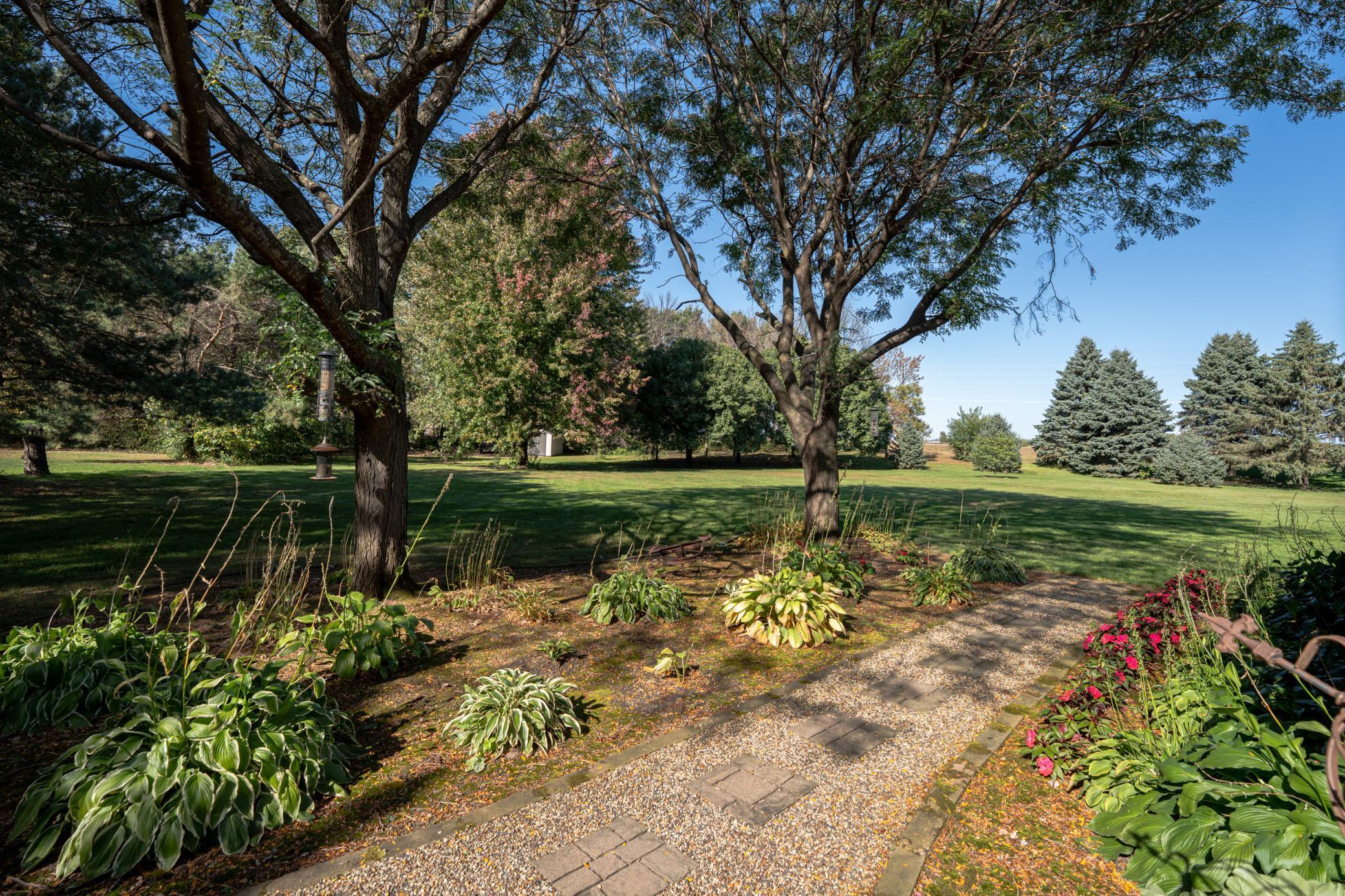 Beautiful landscaping throughout the property including: Hostas, Hydrangeas, Daylilies, Redbud tree, Lilac tree, apple tree & ornamental pear trees.
