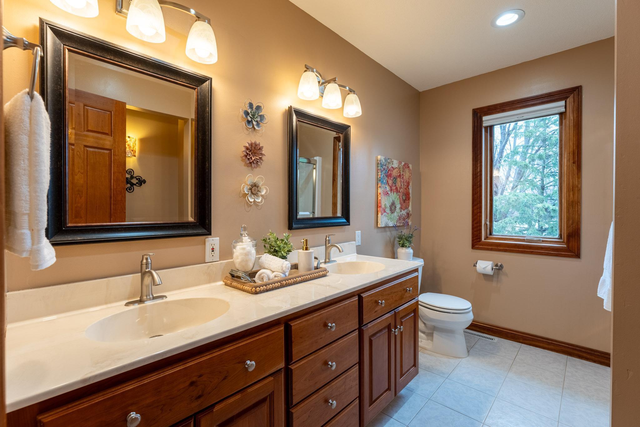 Full bathroom with double sinks. Bathroom dimensions 10 x 7.5 ft.