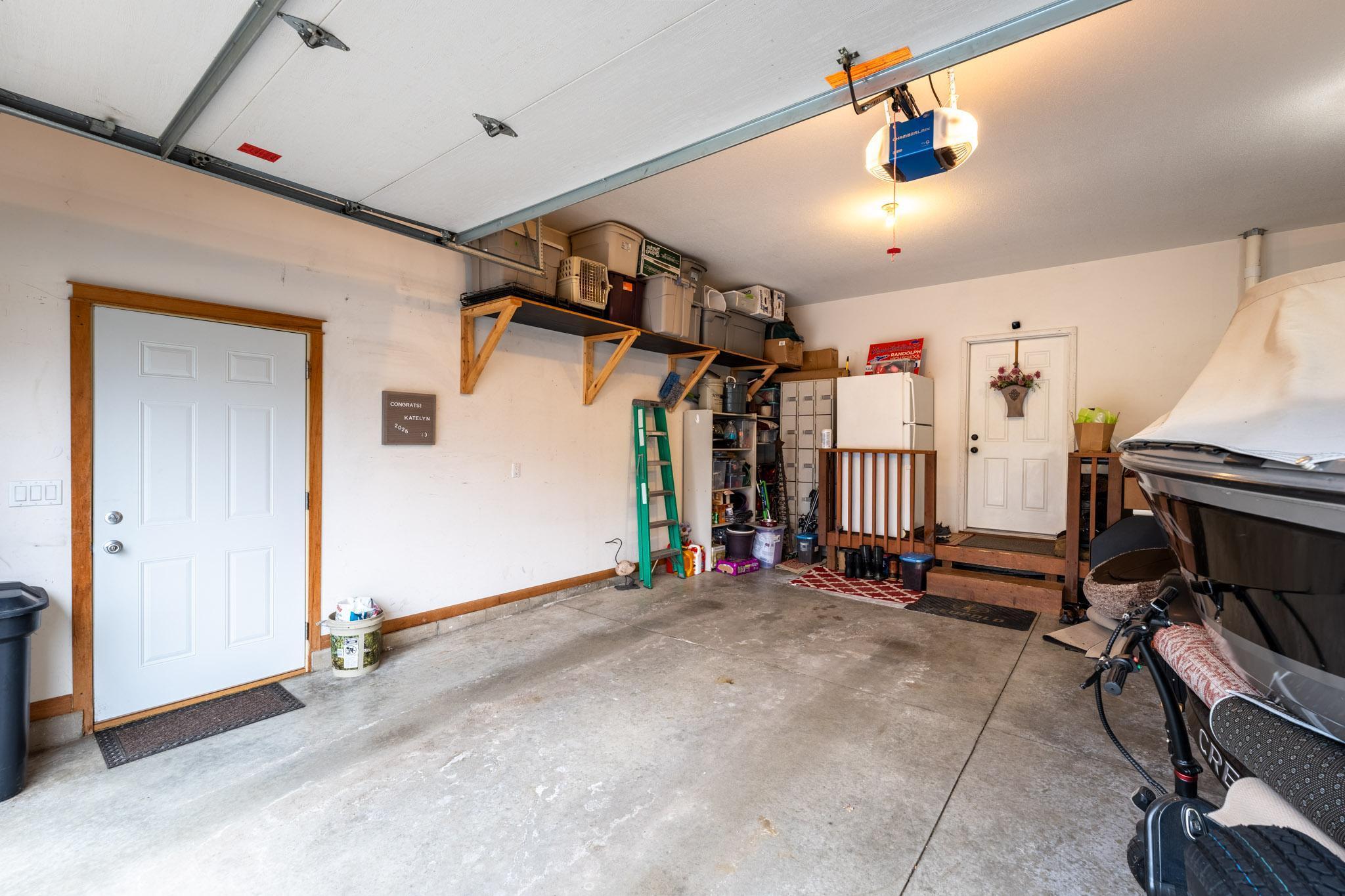 The 4-car insulated, heated garage features a rear overhead door, side service door and storage cabinets.