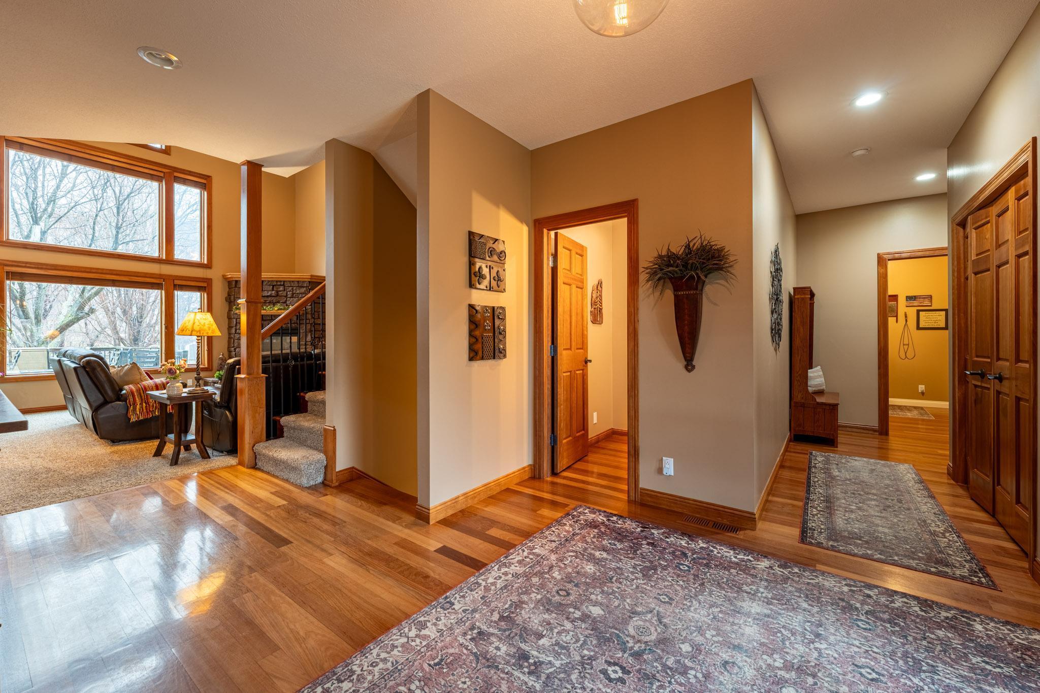 The garage entrance, laundry room & coat closet are off to the right and convenient half bath.
