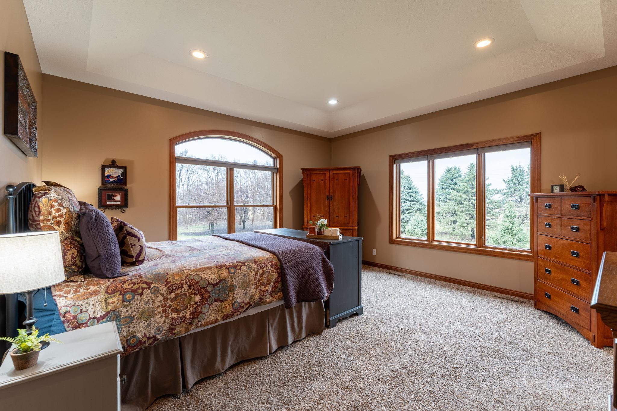 The large owner’s suite occupies its own private level and features a tray ceiling & full en-suite bath.