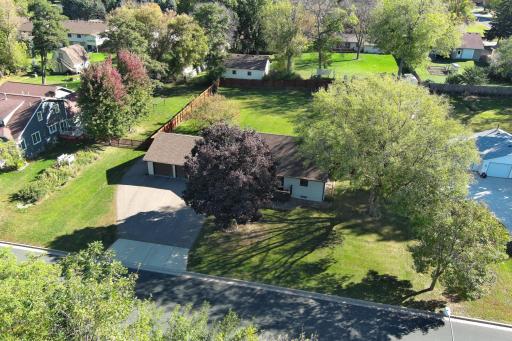 Large private yard centrally located in town with wooded natural area across the street