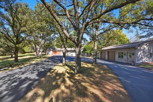 Nestled on 5+ acres, this wooded paradise is wonderfully maintained w/ brick front and steel siding