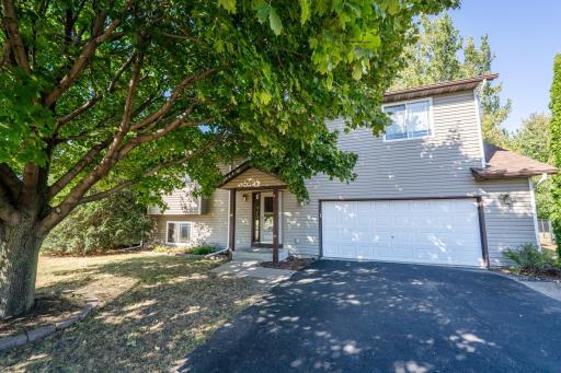 Maintenance free exterior, newer roof, 2 car attached garage and huge fenced back yard!