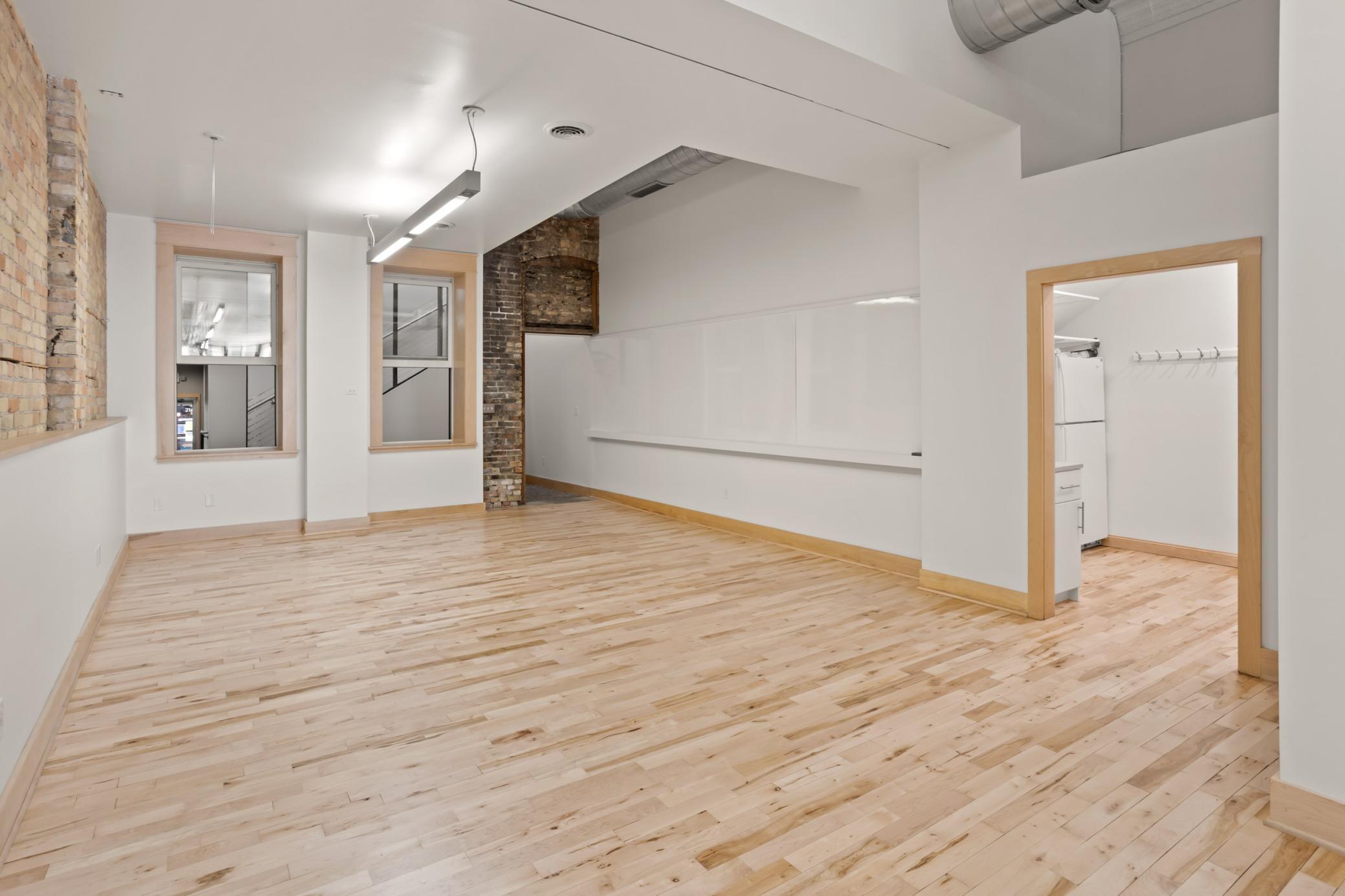 Back entrance to space, windows to back foyer