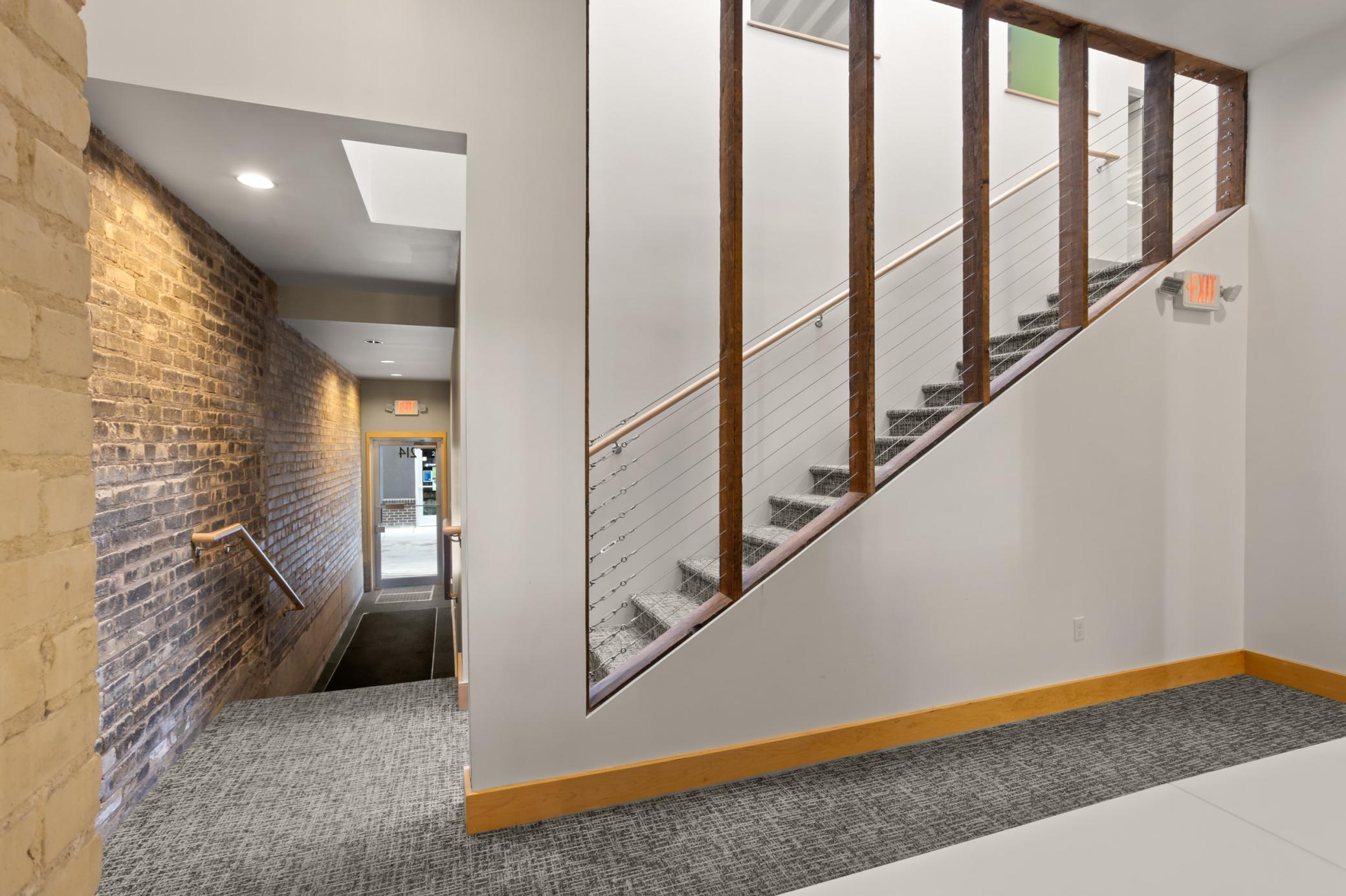 Back foyer, stairway to upper level, hallway to alley entrance