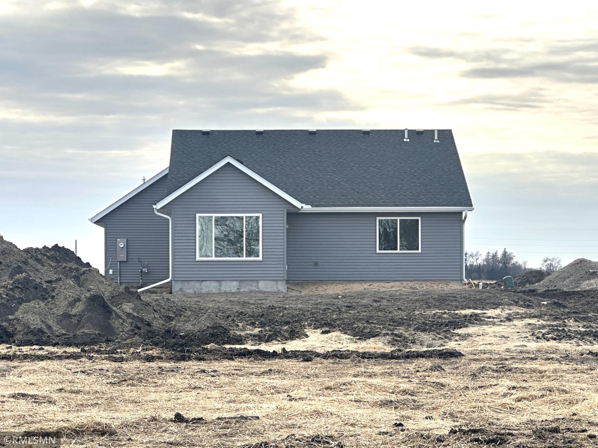 This is the rear view of the new home being built. There will be a spacious patio on the back side of the home to entertain on.