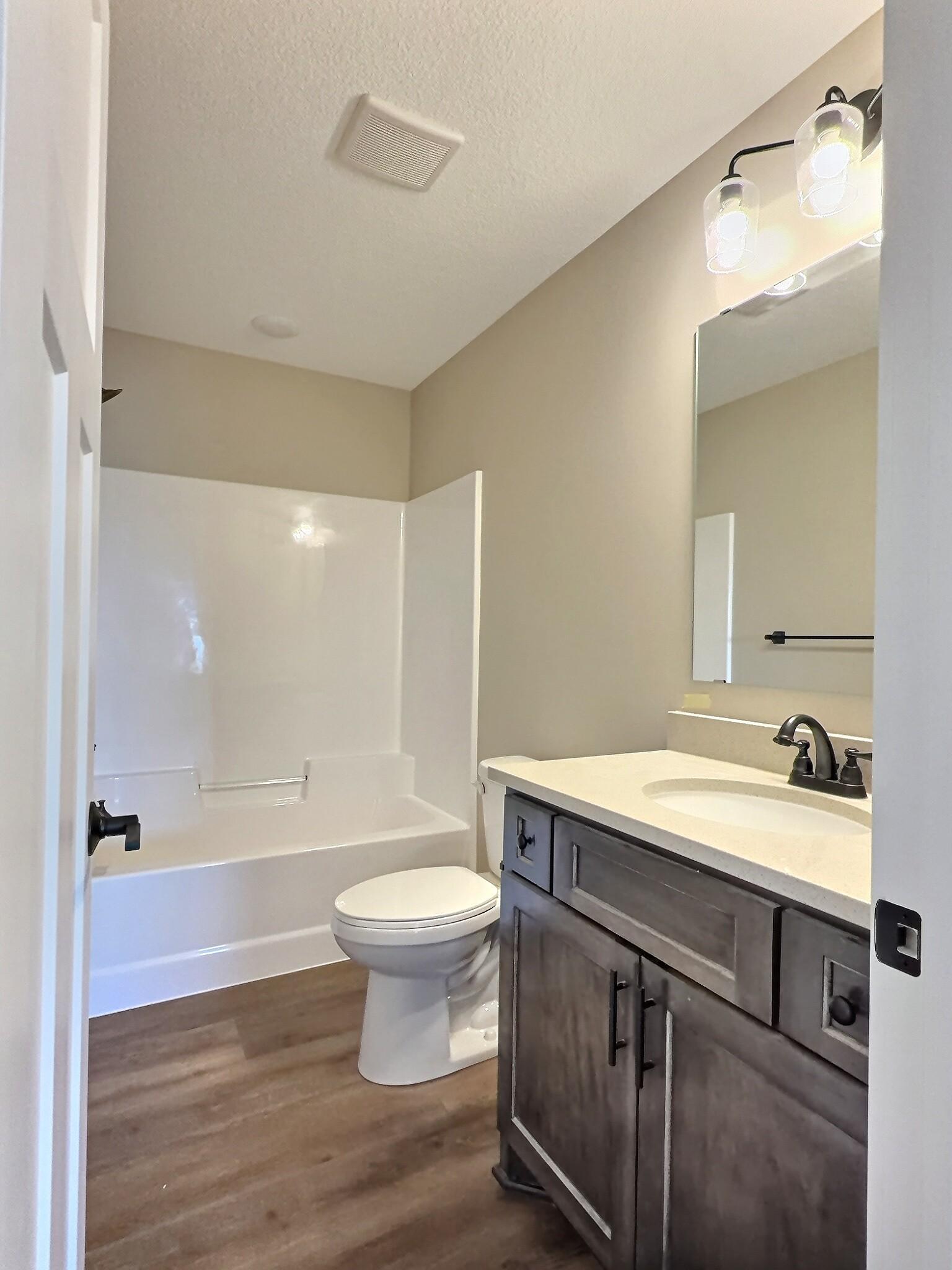 The 2nd bathroom is a full bath that is conveniently located off the 2nd bedroom and main entertaining area of the home.