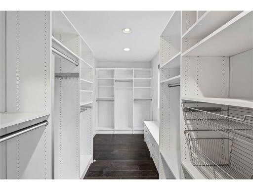 Large walk-through closet off of primary bedroom to main bath