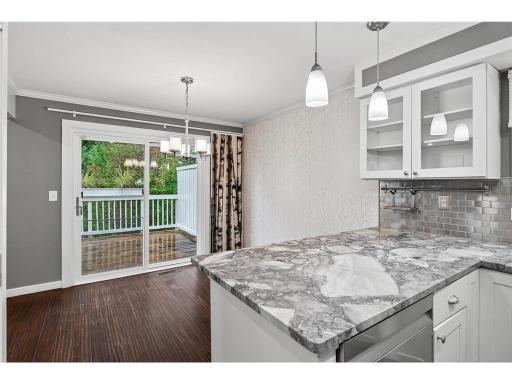 Freshly painted and stained oversized deck just off the dining area—perfect for seamless indoor-outdoor entertaining.