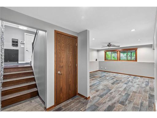 Lower level living space featuring newer tile