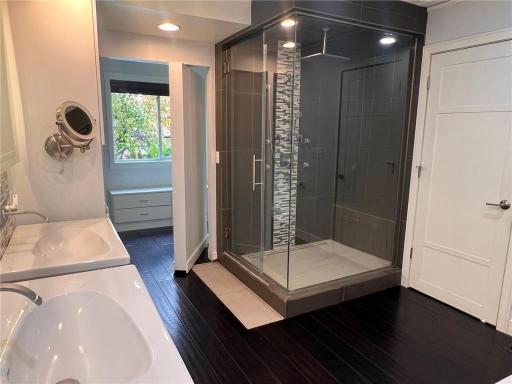 Enjoy the luxury of a steam shower in your own home, complete with a rainfall showerhead and built-in bench for the ultimate spa-like experience.