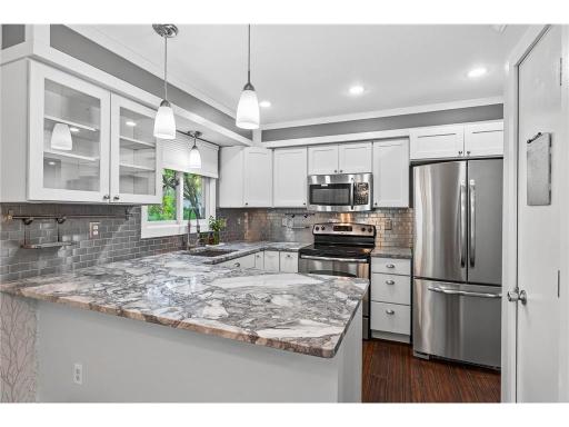 Beautifully appointed with granite countertops and stainless steel appliances, blending durability with modern style.