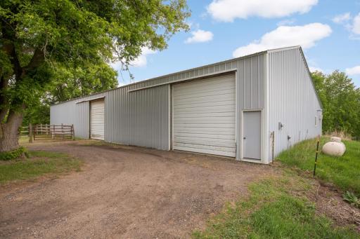 40x108 pole barn with plenty of electric and attached heated/cooled workshop!