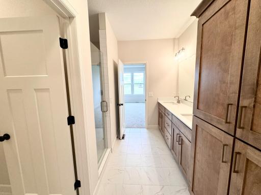 Primary Bathroom with Walk in Shower and Separate Toilet Room