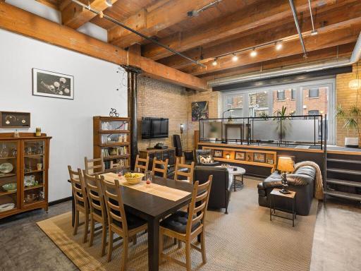 Exposed beams and brick walls are authentic to the building