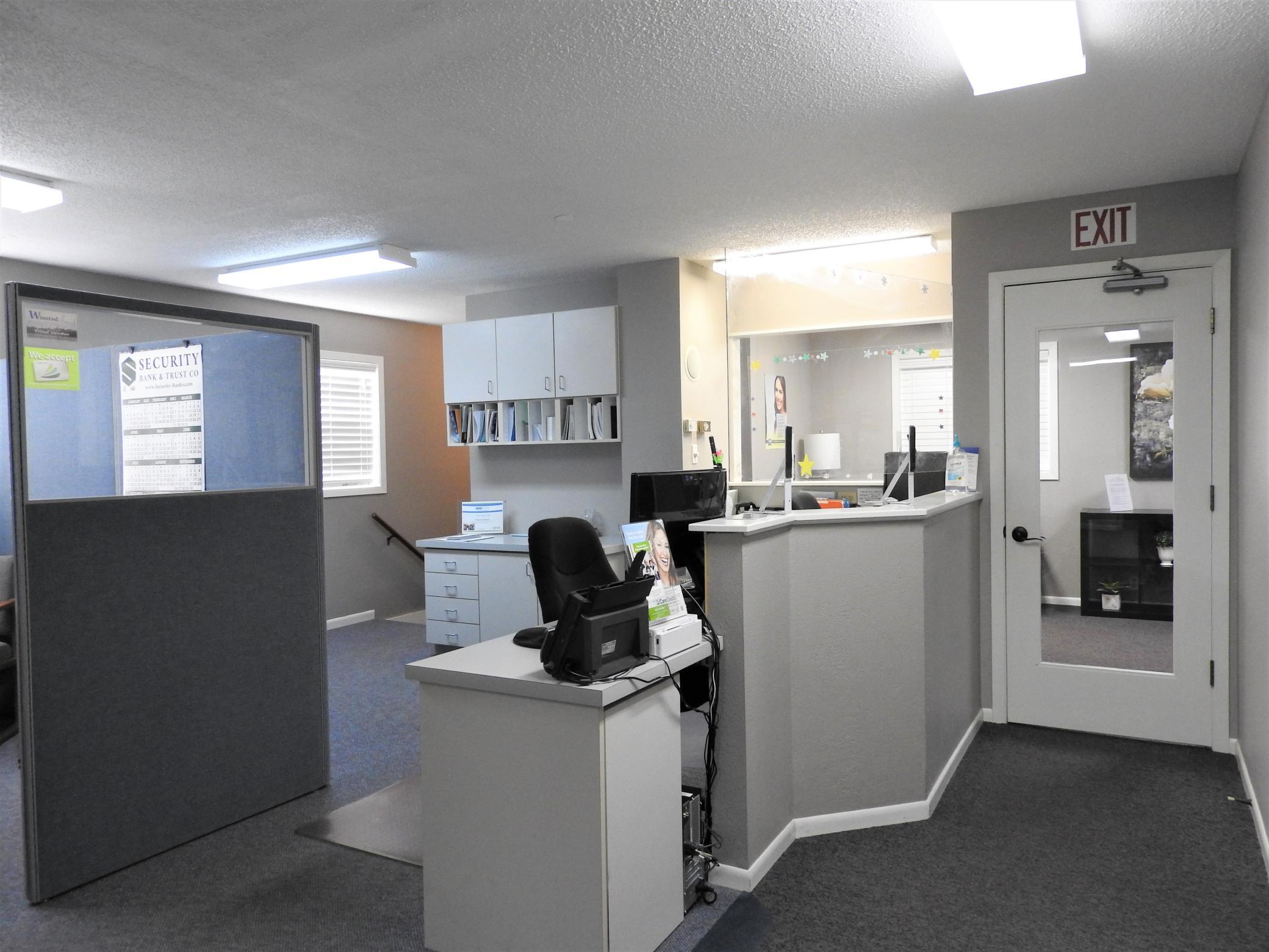 Open office space looks into waiting room