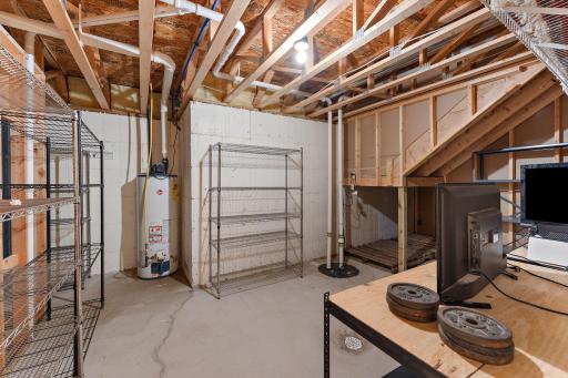 One of two lower level storage and utility rooms - new sump pump and water heater!