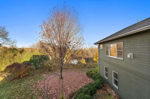 Serene pond views from the deck, primary suite, and dining room table