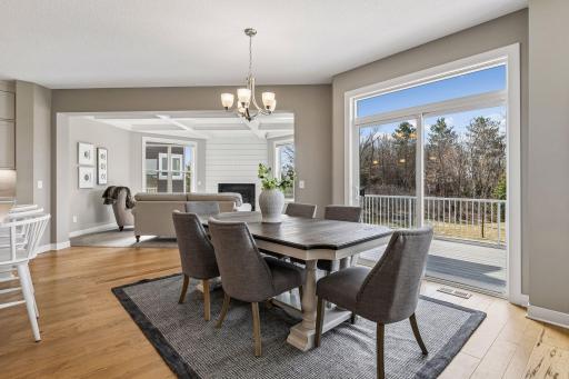 Informal dining area adjacent to the kitchen and living room with direct access to the deck and sunroom.