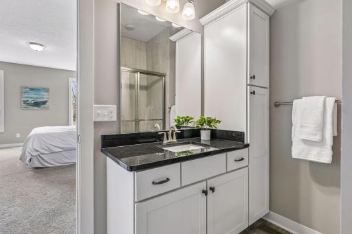 3/4 bathroom attached to the main level bathroom with lots of great storage and granite countertops.