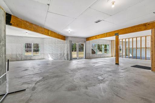 Huge unfinished walk-out lower-level waiting for your finishing touches! Plumed for a future bathroom and wet bar. The home offers two zone heating and cooling on the upper two levels of the home.