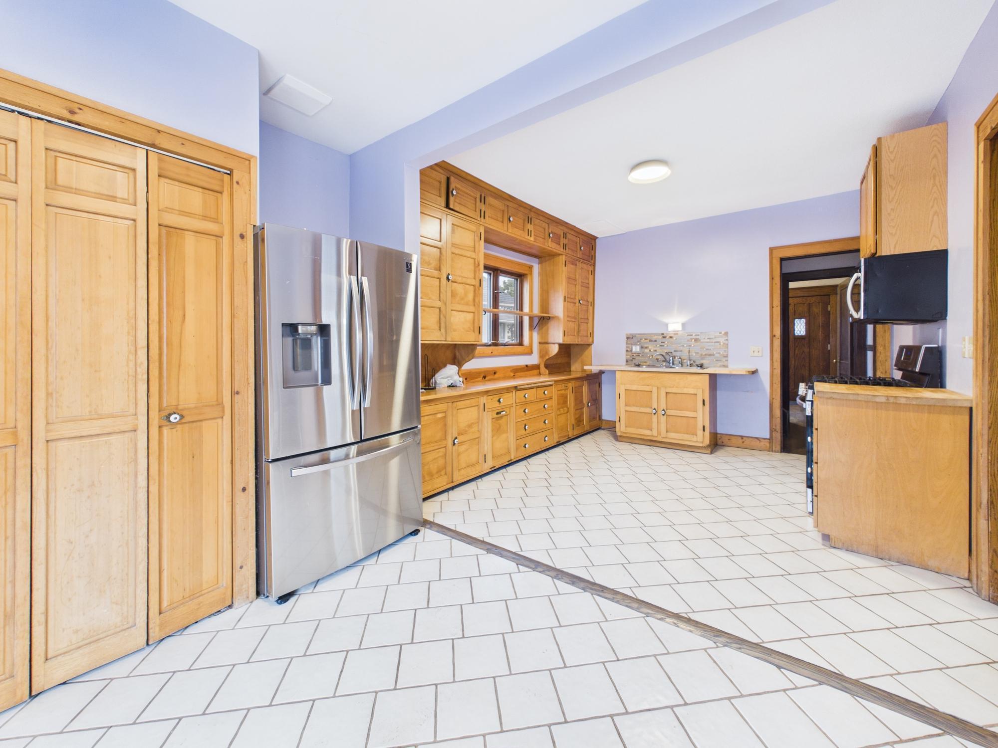 Large eat-in kitchen, restored vintage cabinetry and newer appliances - 3032 Longfellow Ave., Minneapolis