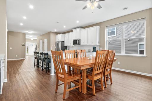This view seamlessly flows into the bright dining area,featuring a well-placed window that fills the entire space with natural light.