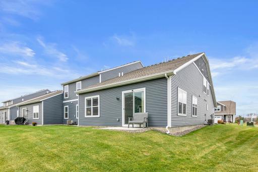 Private outdoor patio located off the main living area, offering exclusive outdoor space unique to this end unit.