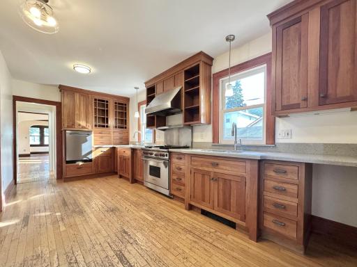 A Chef's Kitchen Dream with 2 Separate Sinks, Large Stove/Oven with Food Heating Lamps