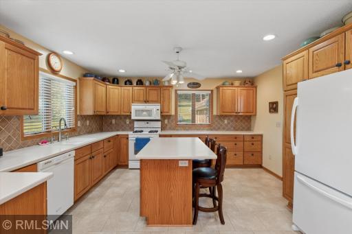 Awesome kitchen with large eat around island, abundance of cabinet and counter space!