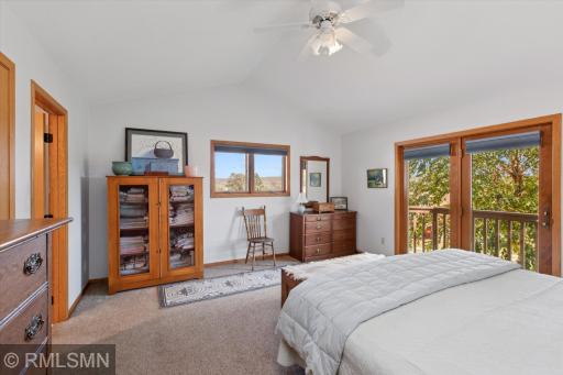 Primary bedroom with small deck (perfect for morning coffee), private full bath and large walk in closet.