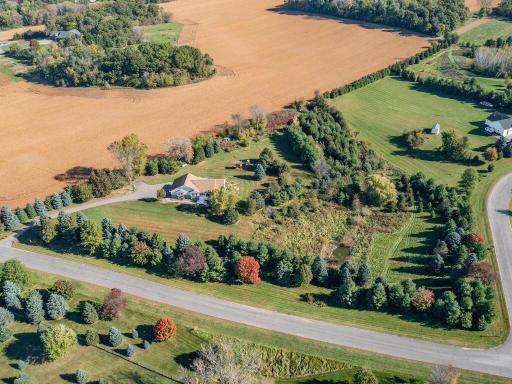Expansive 5.85-acre setting offering privacy, open space, and mature trees.