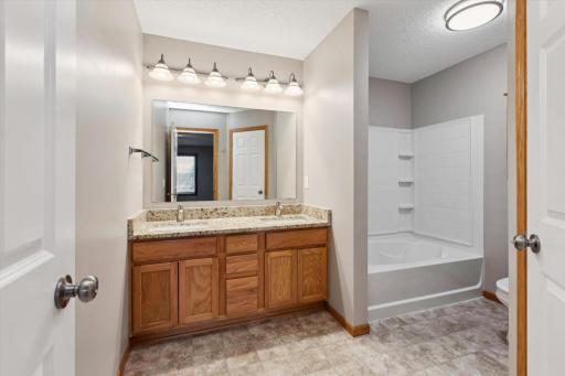 Full upper level bathroom with double sinks