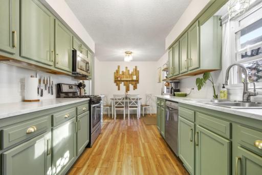 This is your view of the updated kitchen upon entry of the side door. Easy access for bring your groceries in.