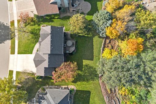 Enjoy the best of both worlds - a flat yard and wooded privacy.