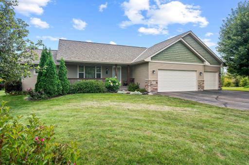 Front exterior showcasing beautiful landscaping